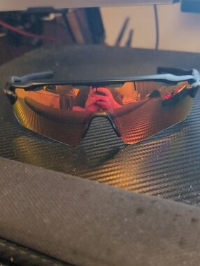 Oakley Black Frame Sunglasses with Red-Orange Mirrored Lens